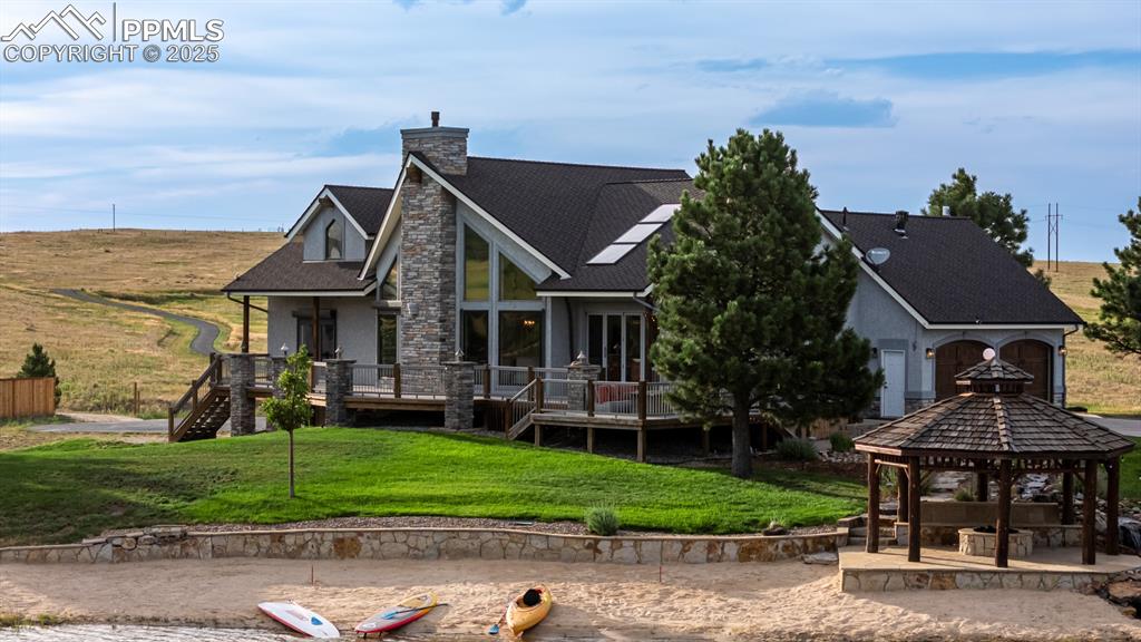 Caption: One in a million lake front compound with 900ft of frontage, guest house and detached garage all on 