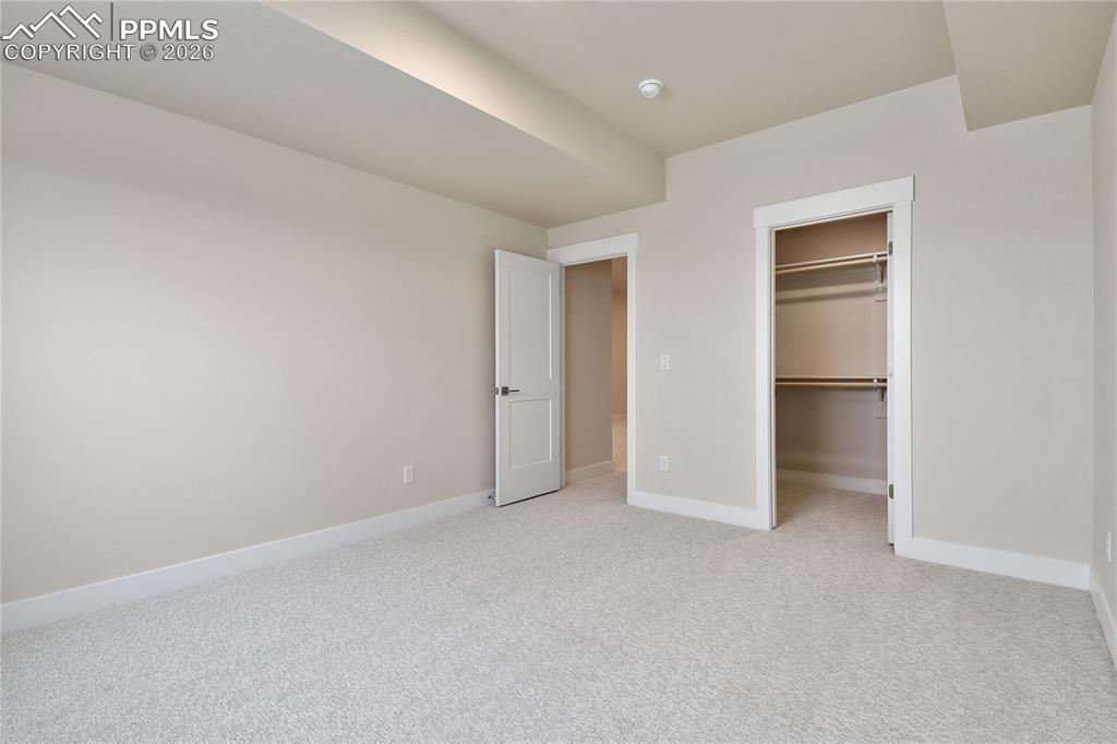 Image 29 of 35: 3rd bedroom with walk-in closet