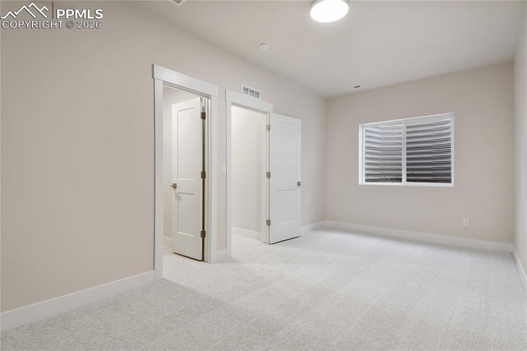 Image 32 of 35: 4th bedroom with walk-in closet