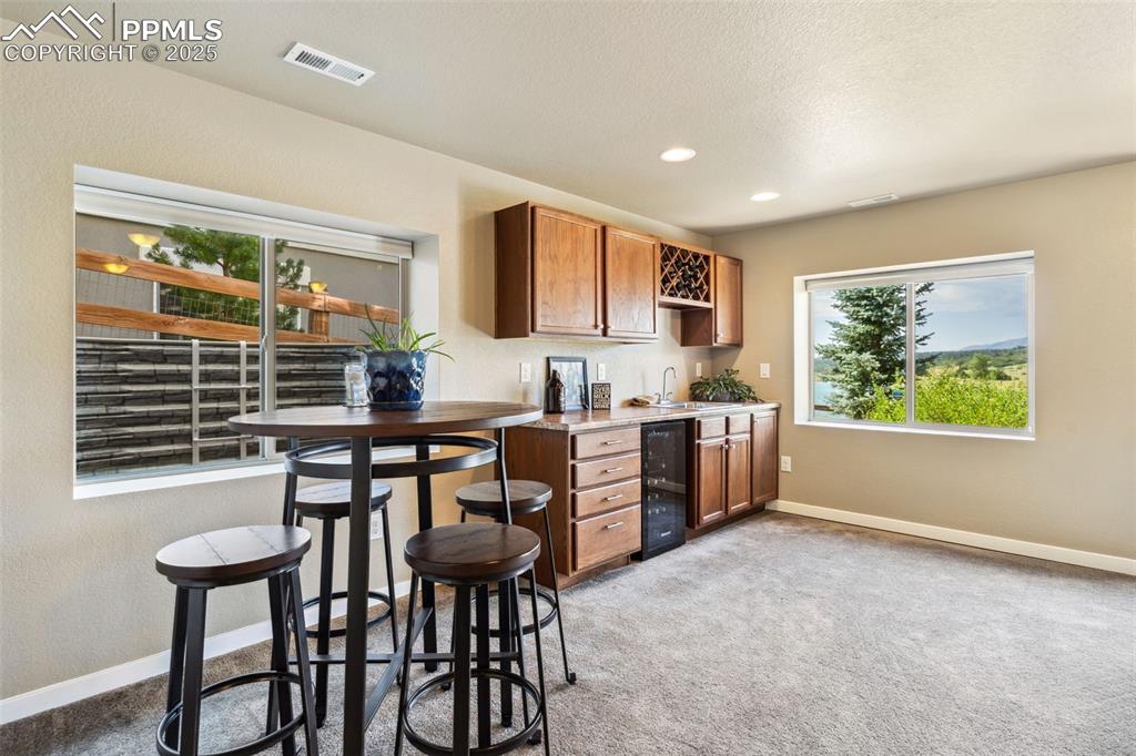 Image 19 of 47: Wet Bar and Space for a Game Table