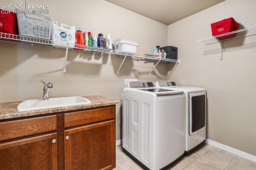 Image 36 of 47: Utility Sink and Storage Shelving