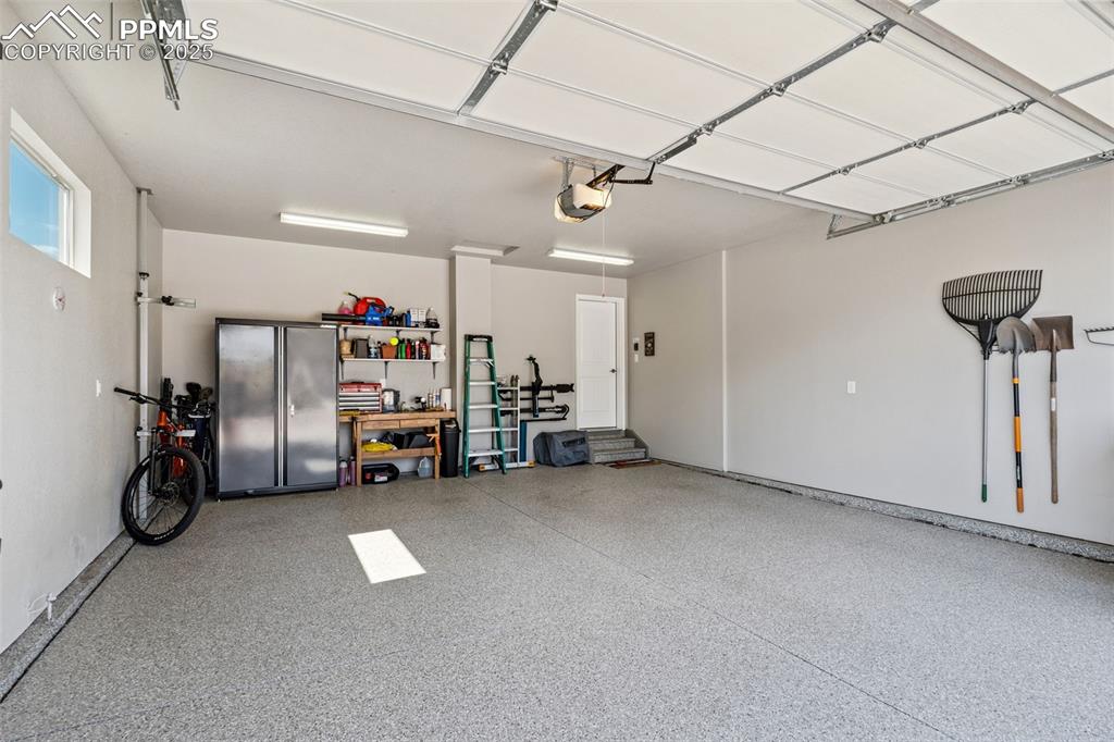 Image 38 of 47: Coated Garage Floor and Textured, Painted Walls