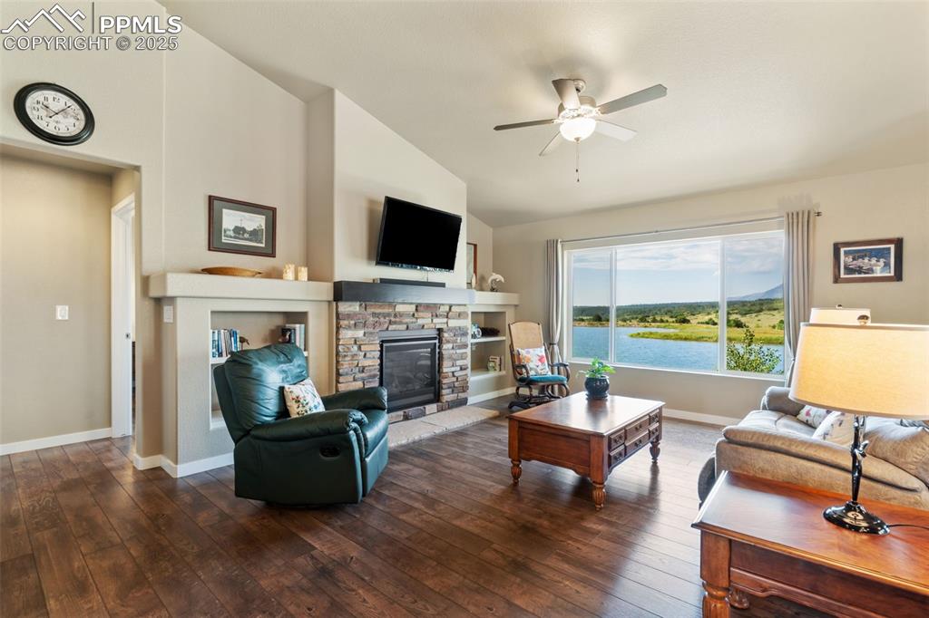 Image 5 of 47: Great Room with Built-ins and Fireplace