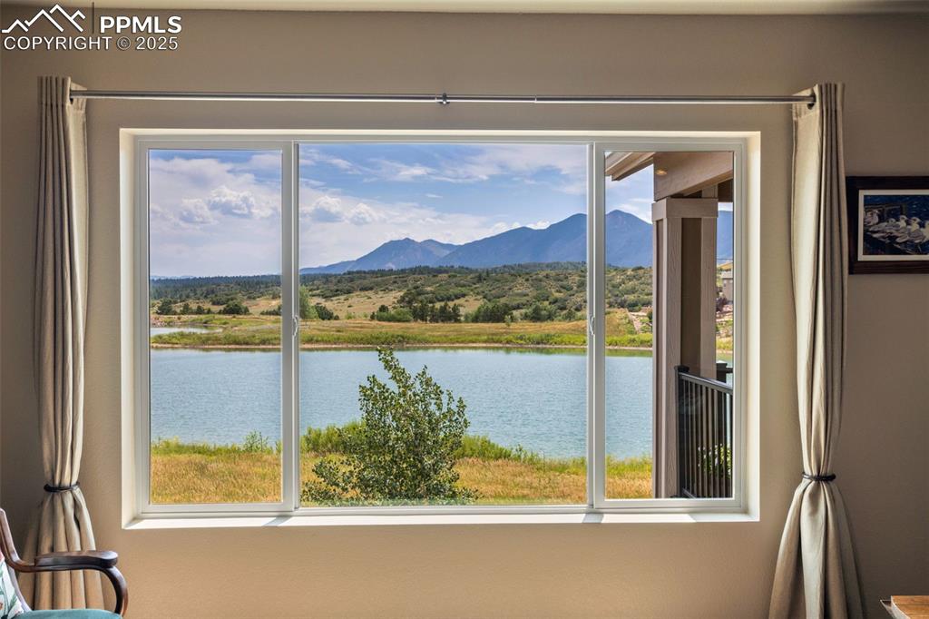 Image 6 of 47: Direct lake view from living room window