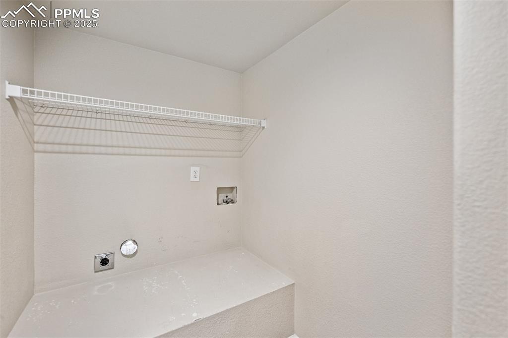 Image 25 of 43: Washroom with laundry area, hookup for a washing machine, and electric drye