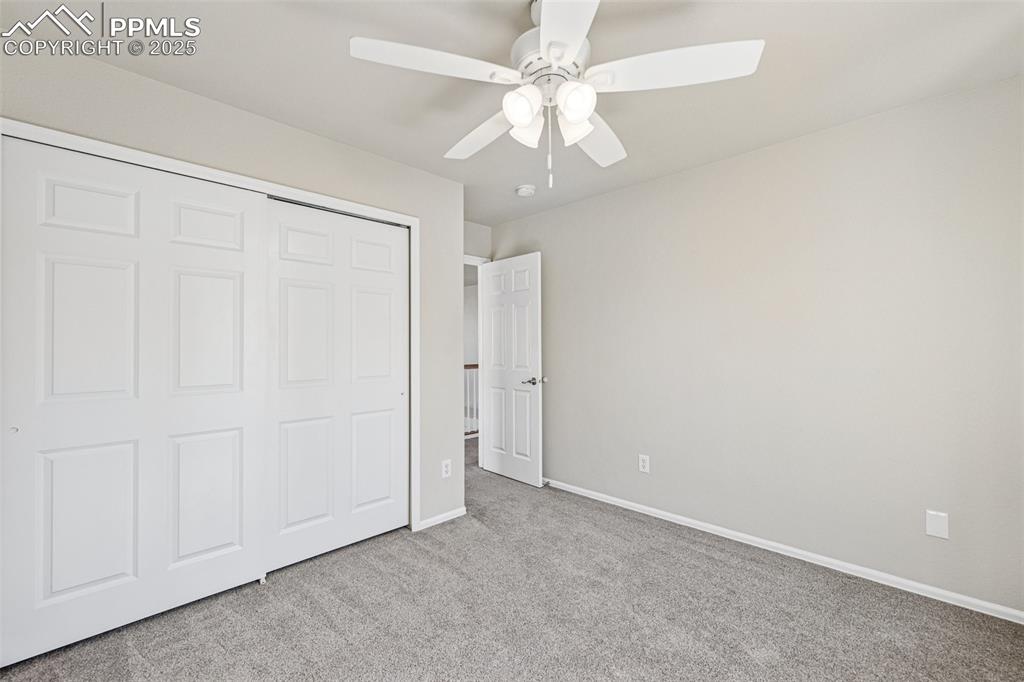 Image 31 of 43: Unfurnished bedroom with a closet, carpet floors, baseboards, and a ceiling