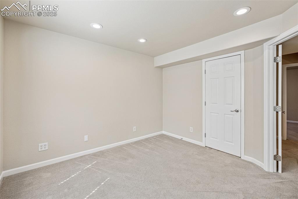 Image 40 of 43: Office / bedroom featuring recessed lighting, baseboards, and carpet