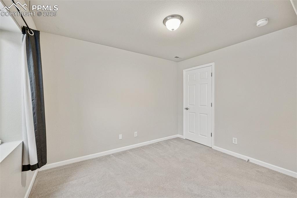 Image 42 of 43: Office with carpet flooring and baseboards