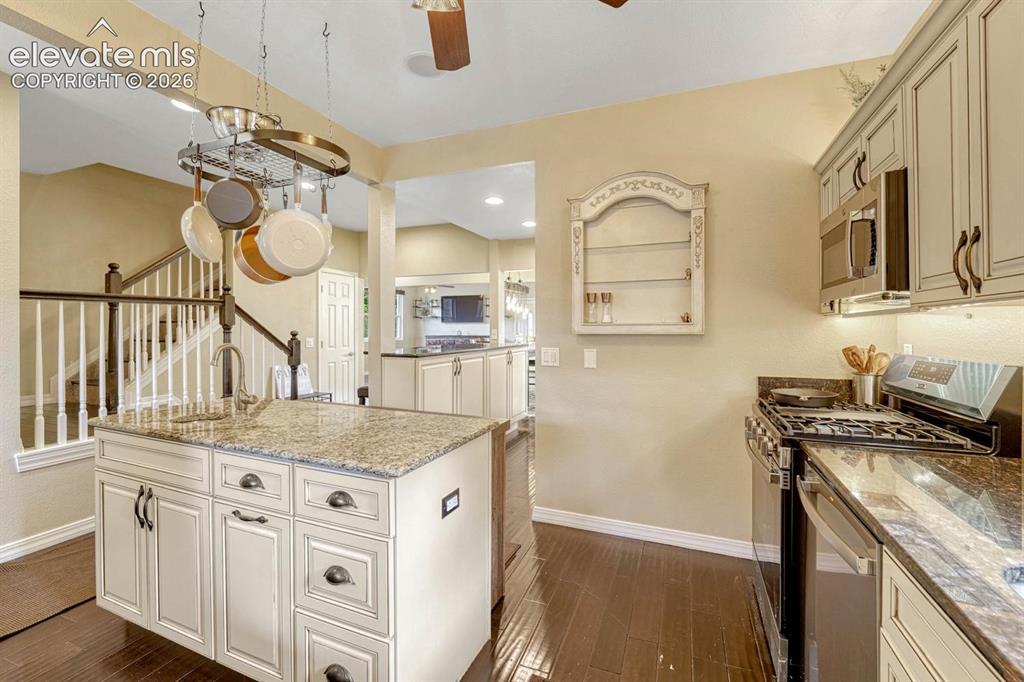Image 11 of 50: Gourmet kitchen with granite counters, brand new stainless steel appliances