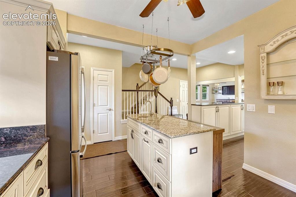 Image 12 of 50: Kitchen island has power and a prep sink