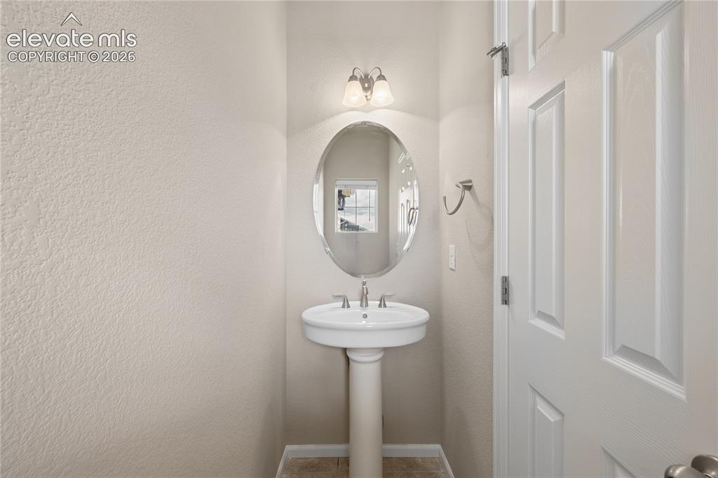 Image 11 of 20: Main level half bathroom 