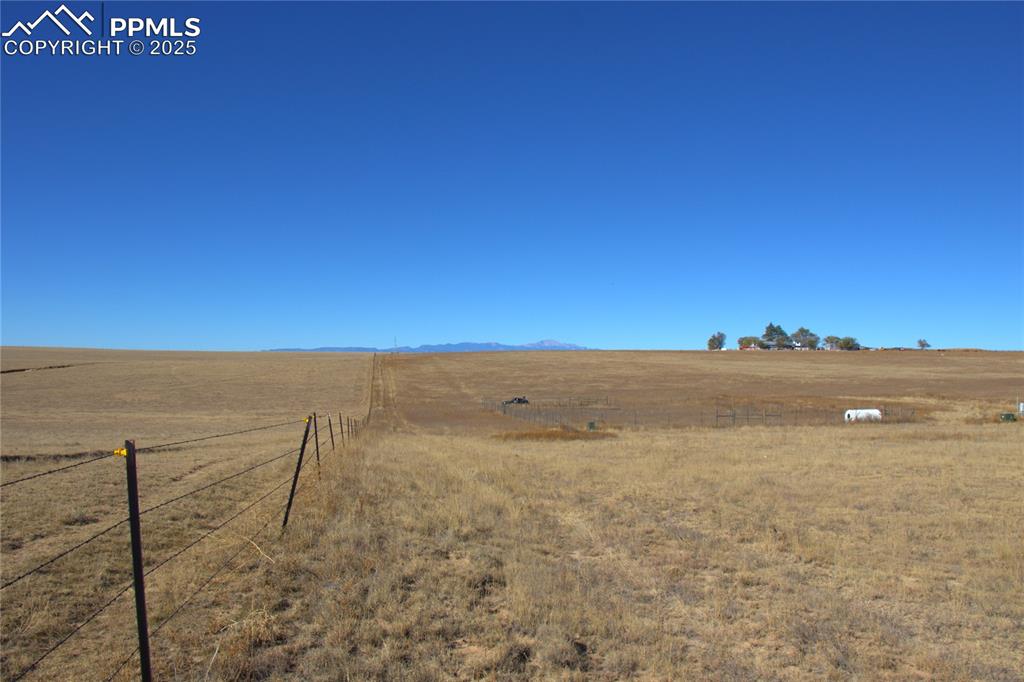 Image 15 of 21: View of yard with a view of rural / pastoral area and a mountain view