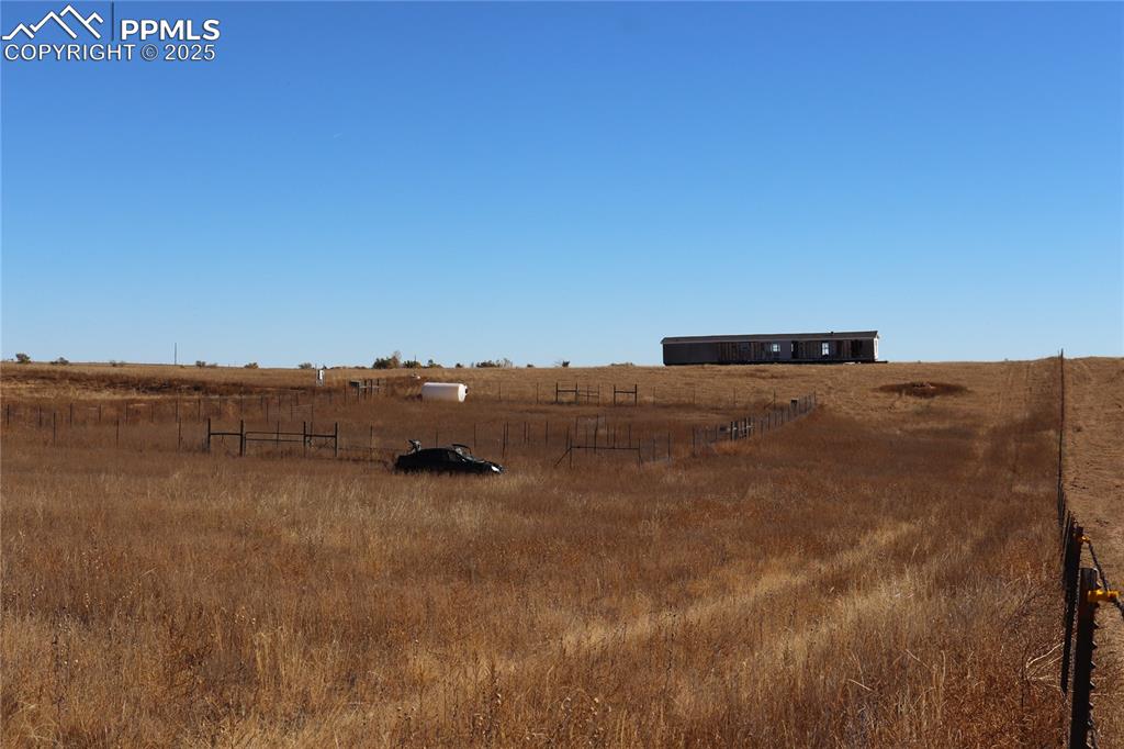 Image 17 of 21: View of yard featuring a view of rural / pastoral area