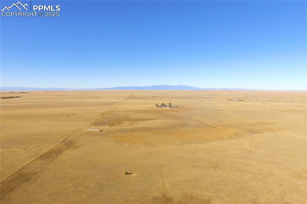 Image 4 of 21: View of rural area featuring a desert landscape and a mountainous backgroun