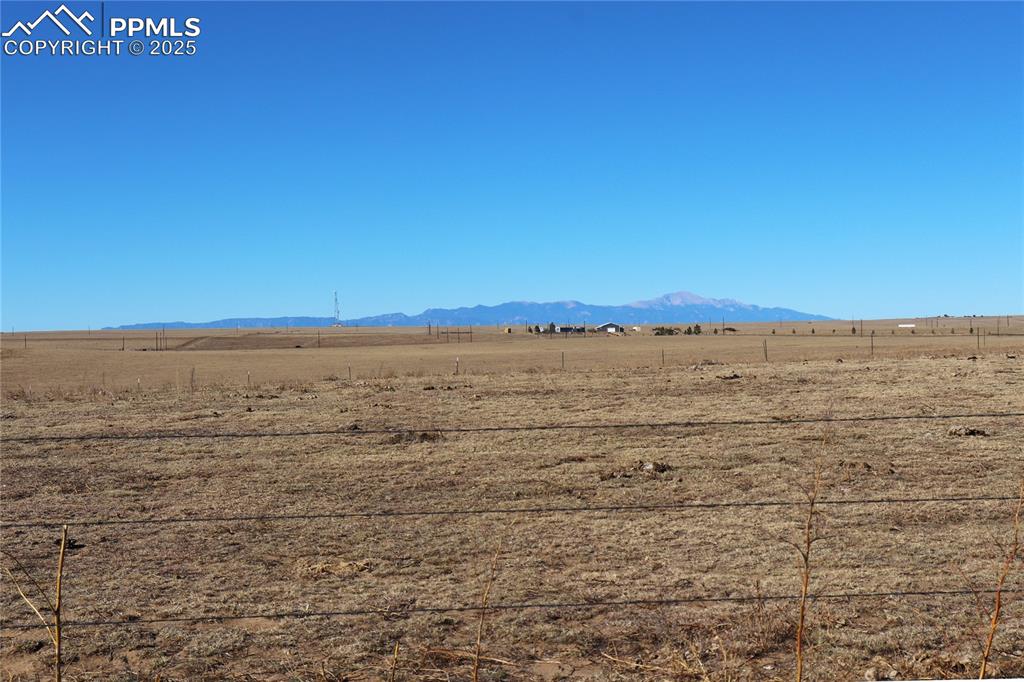 Image 7 of 21: View of mountain background featuring rural landscape