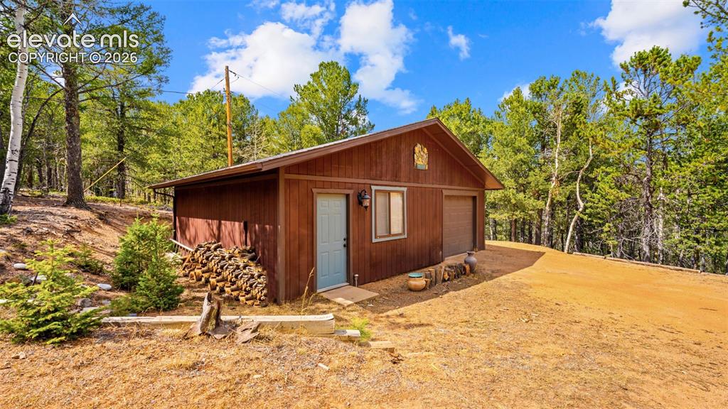 Image 8 of 43: Oversized one-car garage with workshop