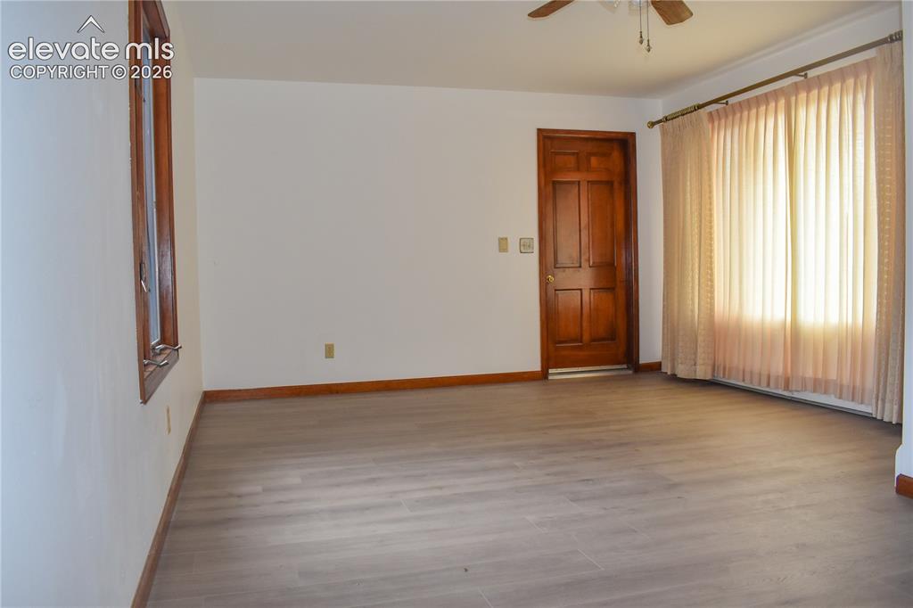 Image 10 of 44: Wood-finish flooring with coordinating wood trim
