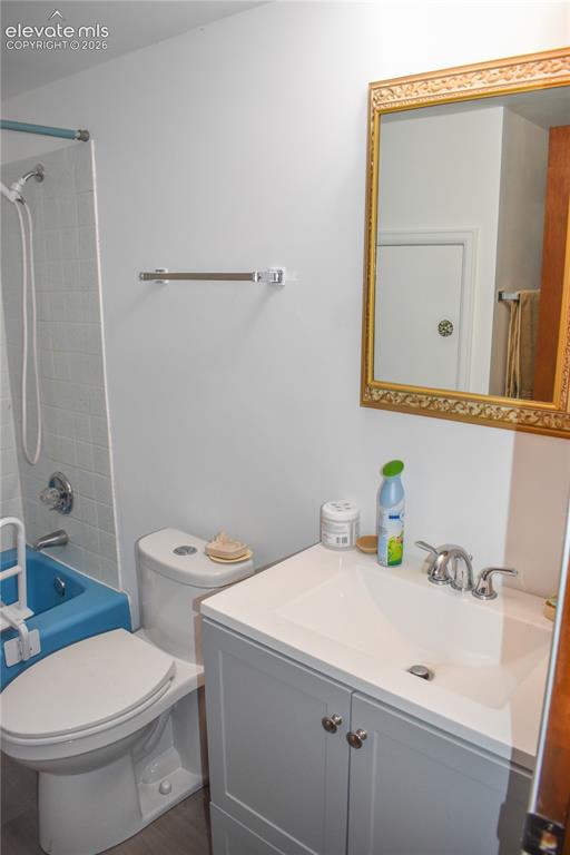 Image 38 of 44: White bathroom vanity with undermount sink and chrome fixtures