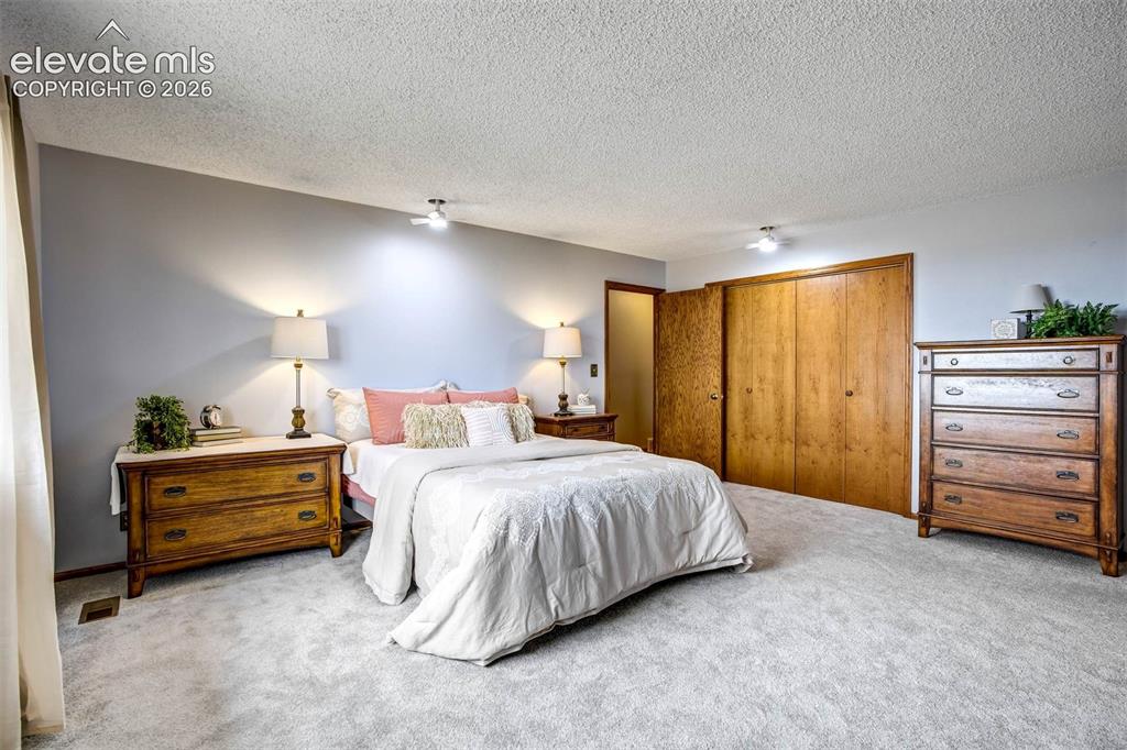 Image 14 of 48: Large double closet, new carpet, south window w/mountain range views