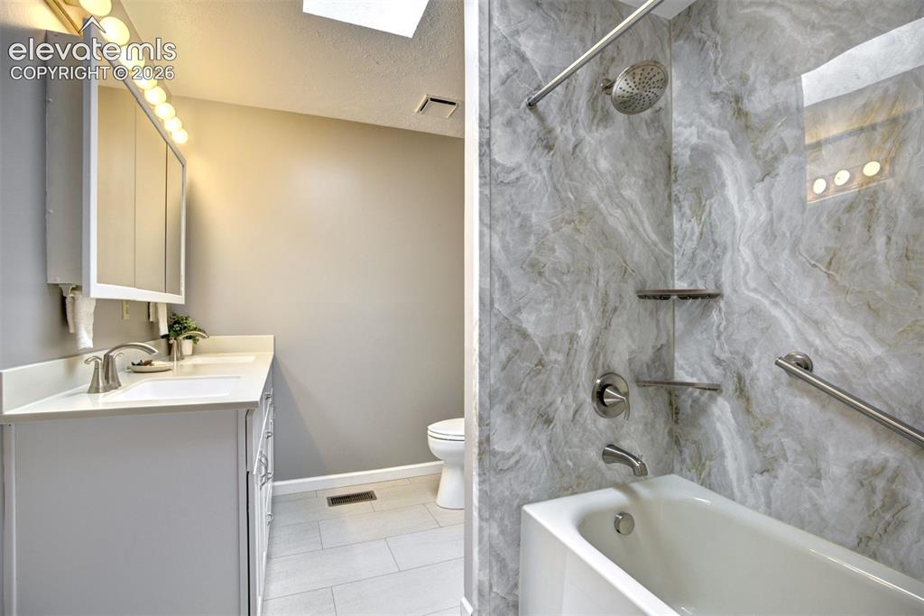 Image 21 of 48: Brand new full bath, main level hallway