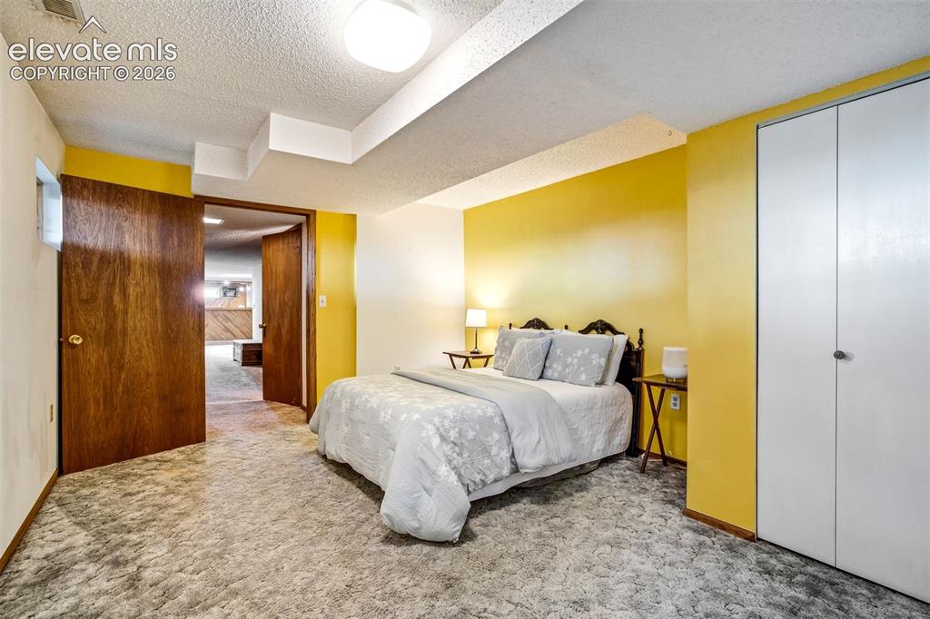 Image 32 of 48: Basement bedroom