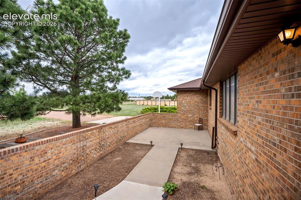 Image 36 of 48: Front enclosed courtyard perfect for gardening, gatherings to enjoy mountai