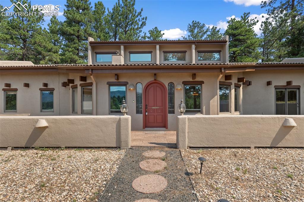 Image 2 of 50: Mediterranean / spanish-style house with stucco siding