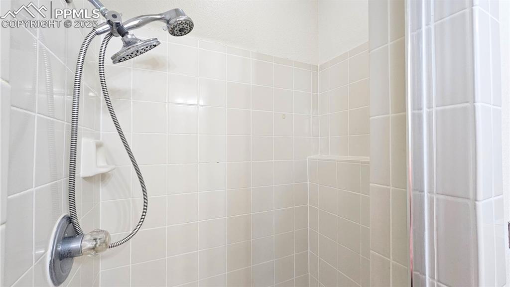 Image 14 of 28: Bathroom view of tiled shower