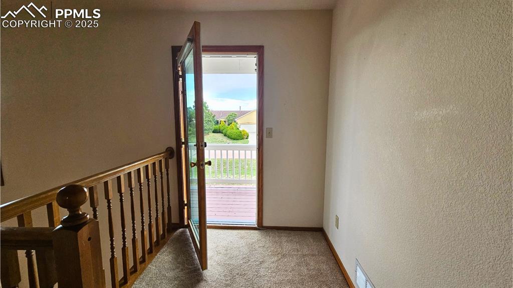 Image 17 of 28: Loft Entryway with Walk-out to Deck - with Access for Bedrooms on Upper Lev
