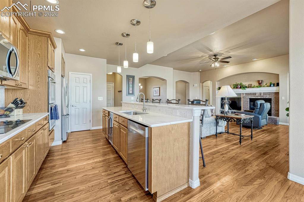 Image 12 of 49: Hardwood through main level living spaces