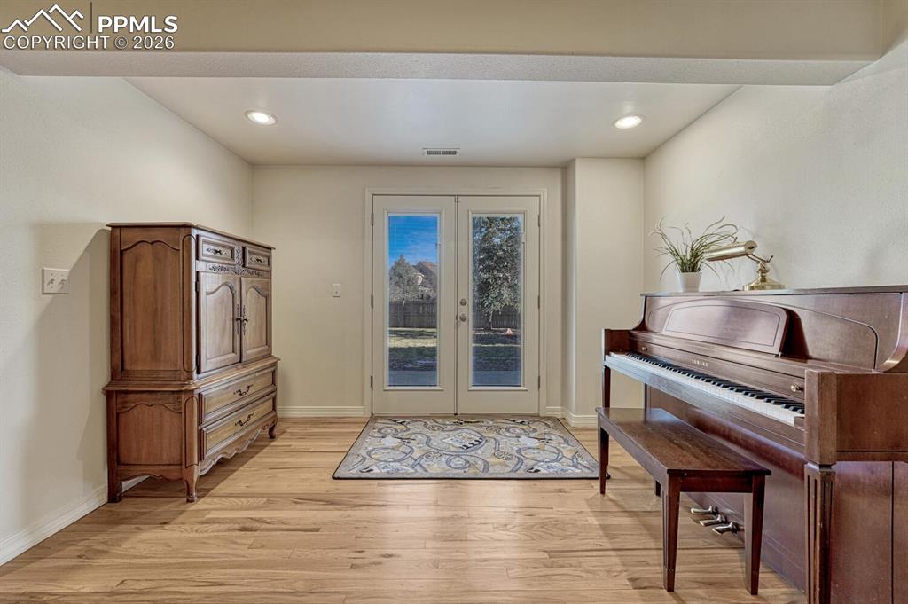 Image 32 of 49: Walkout to Landscaped and Fenced Yard