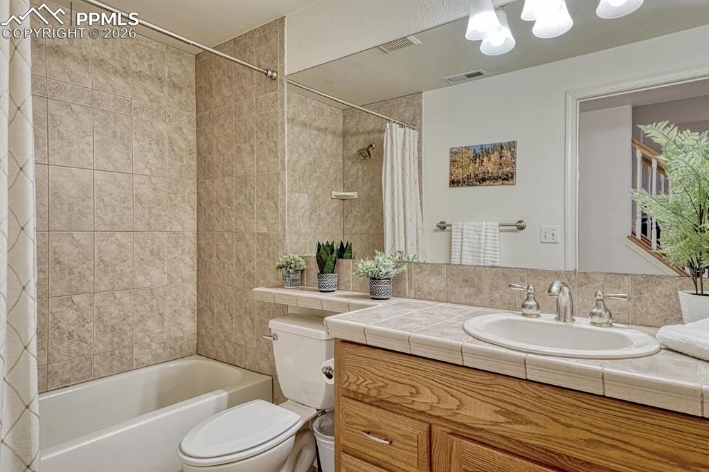 Image 35 of 49: Full Basement Bathroom