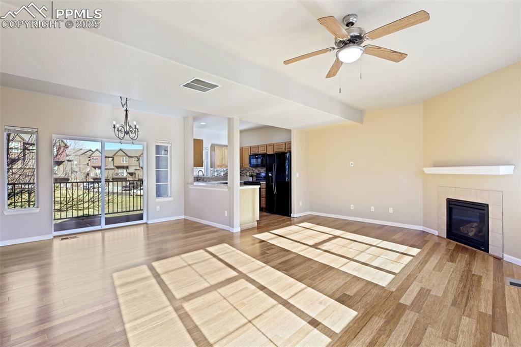 Image 10 of 37: Living room is open to the dining area and kitchen