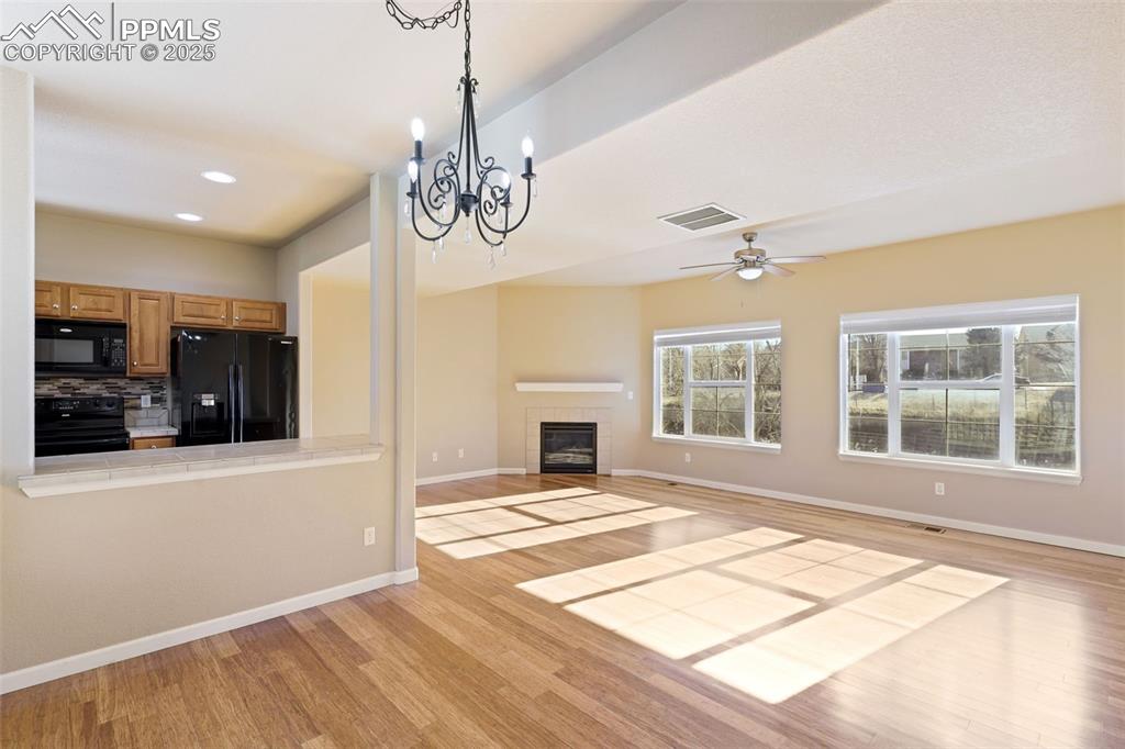 Image 8 of 37: Living looks out onto open space