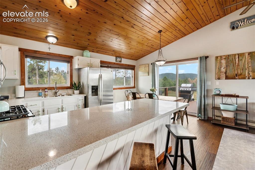 Image 19 of 49: Kitchen and dining room with walk out
