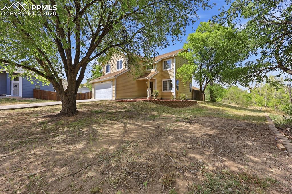Image 3 of 40: Side yard in the front 