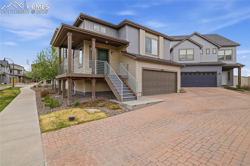 Image 1 of 40: View of front of property featuring an attached garage, decorative driveway