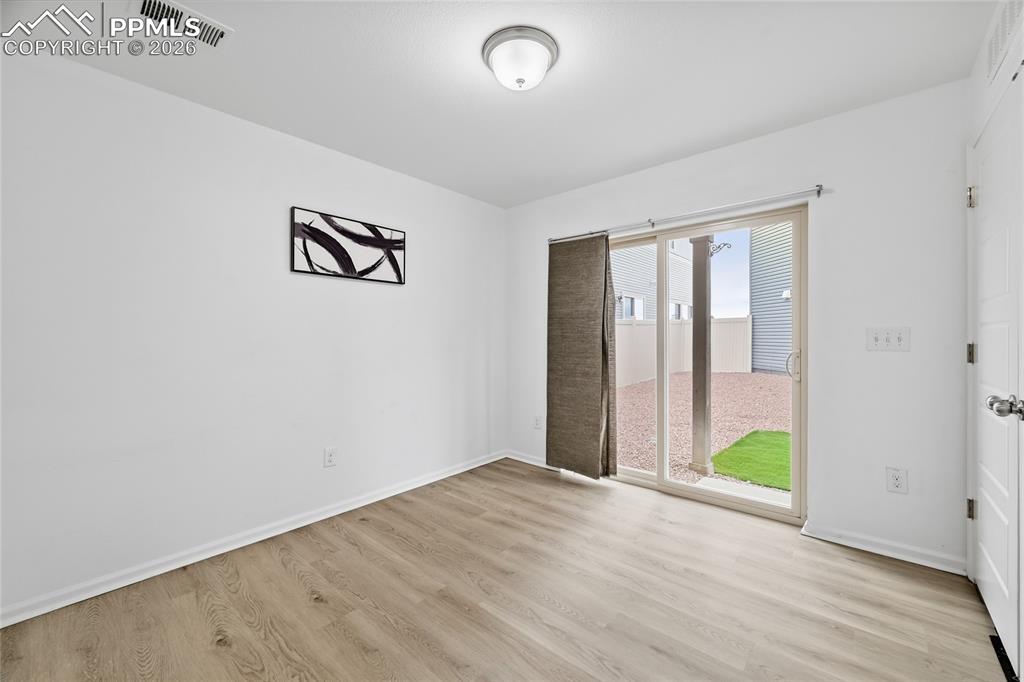 Image 26 of 40: Unfurnished lower-level bonus room with back yard access, and light luxury 