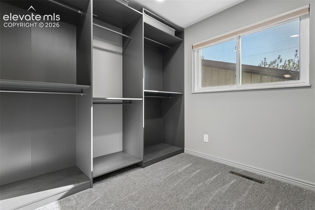 Image 13 of 32: Primary BR Walk-In Ikea Closet