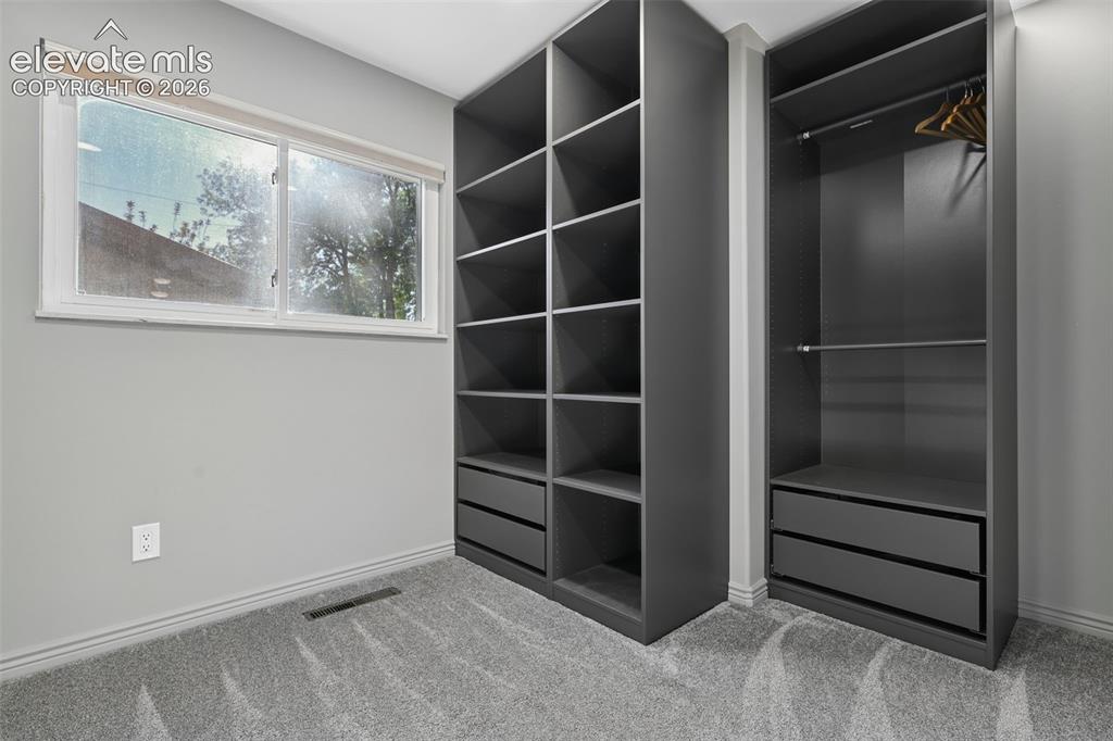 Image 14 of 32: Primary BR Walk-In Ikea Closet