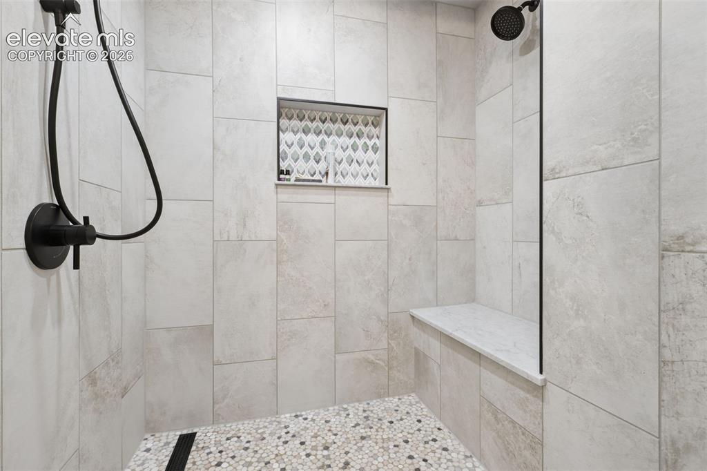 Image 16 of 32: Relax and enjoy the walk-in, double head, steam shower room