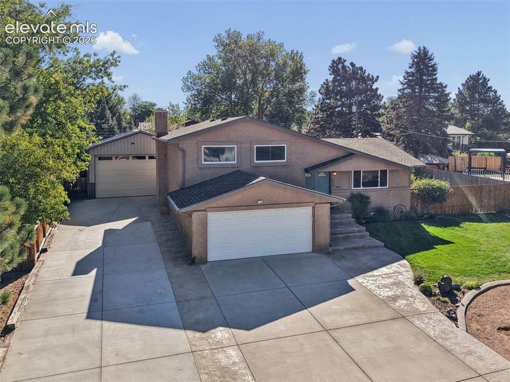 Image 2 of 32: Front of home with detached garage