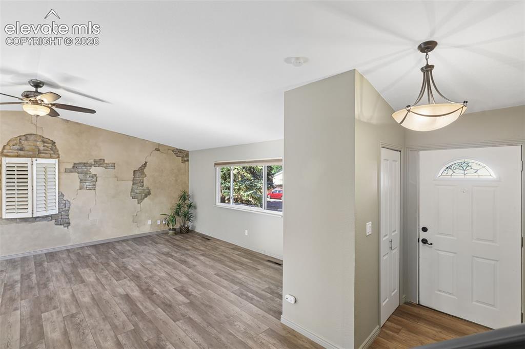 Image 4 of 32: Front 1st/main floor entry and Living Room