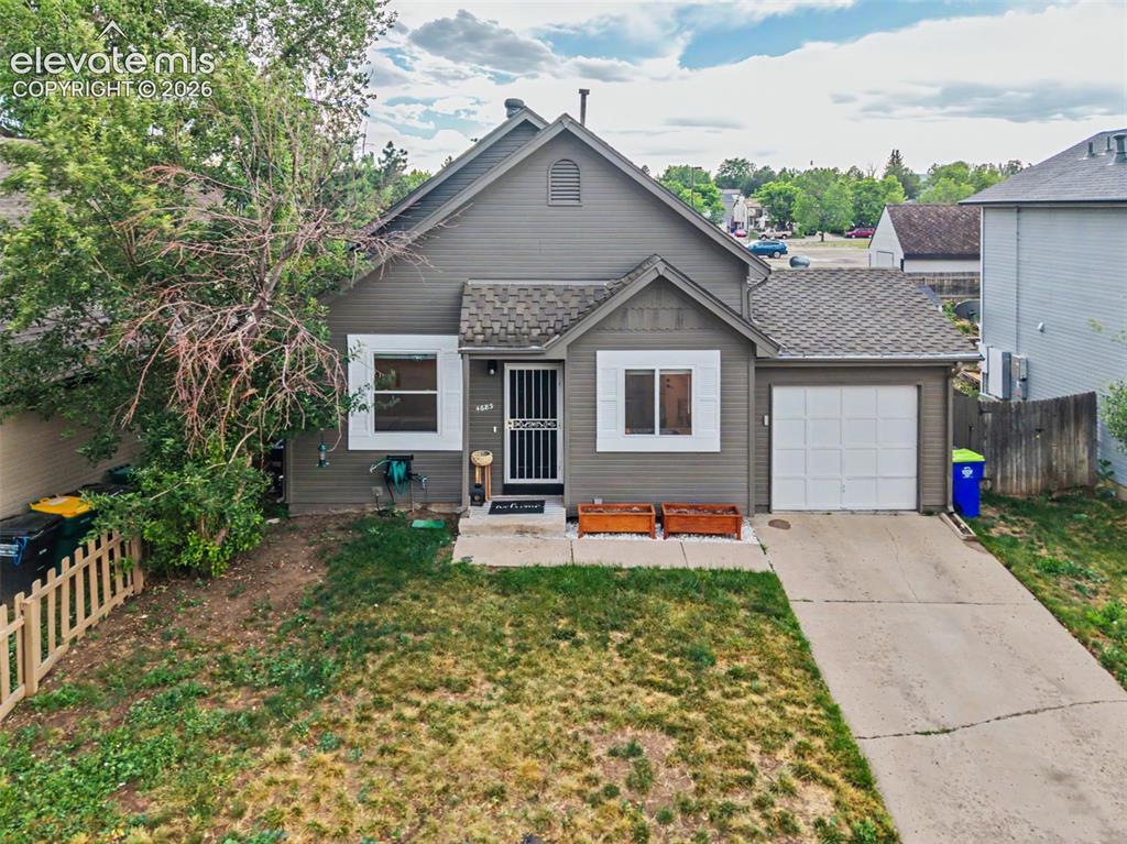 Image 34 of 37: Gray exterior with white trim