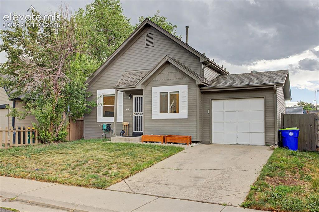 Image 37 of 37: Gray exterior with white trim and shutters, featuring a single-car garage w