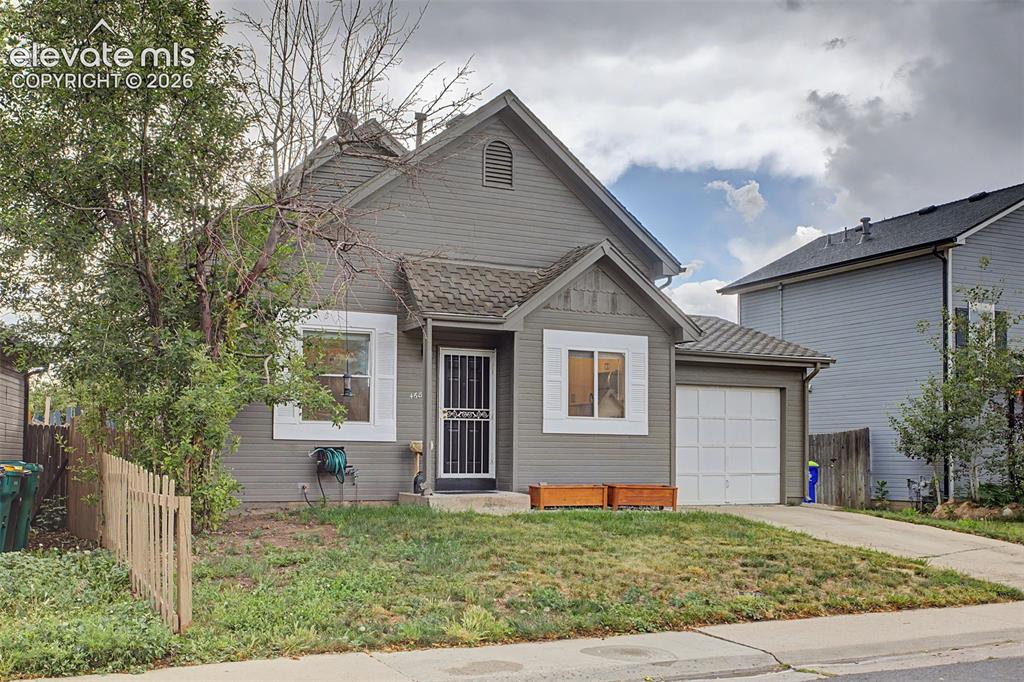 Image 5 of 37: Gray siding exterior featuring a prominent front gable