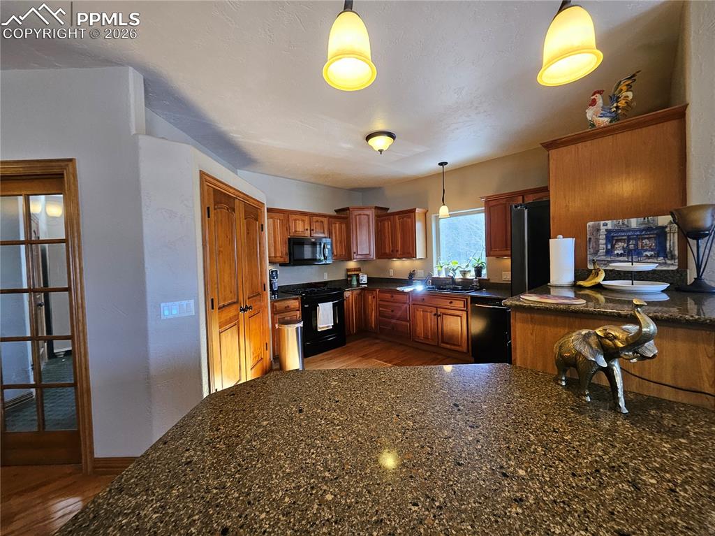 Image 6 of 48: View of the kitchen from breakfast bar
