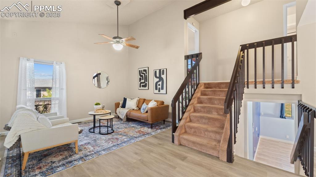 Image 4 of 38: Spacious living room with vaulted ceilings.