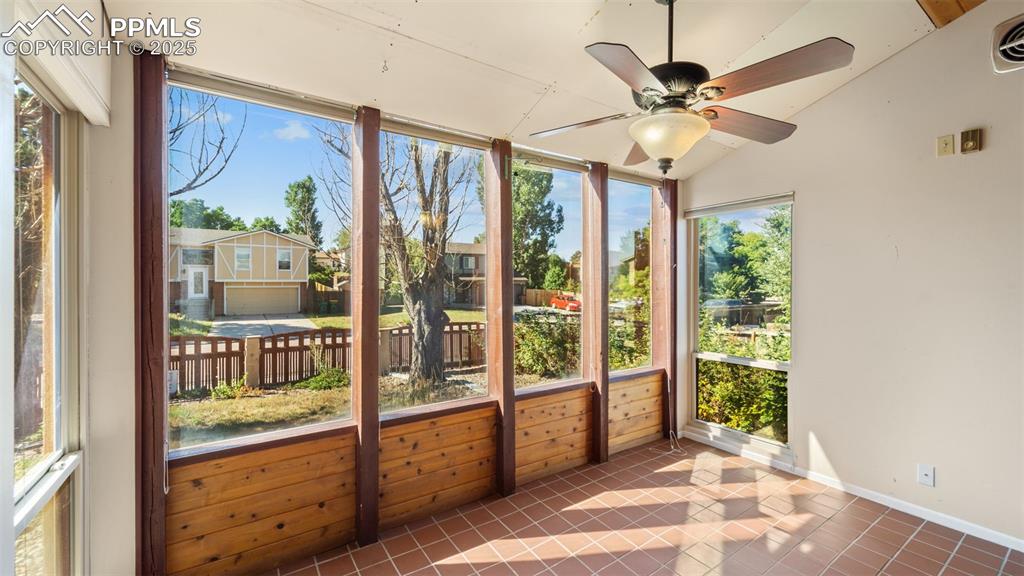 Image 6 of 38: Sunroom is a great additional space for relaxing, workouts, or other activi