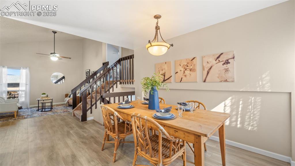 Image 8 of 38: Dining area adjacent to living room and kitchen